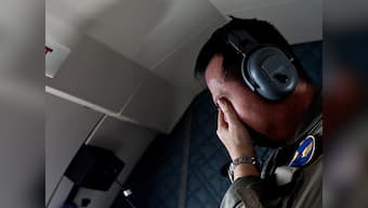 Sonar images find AirAsia's QZ8501 wreckage: Victim wearing life jacket raises questions about crash