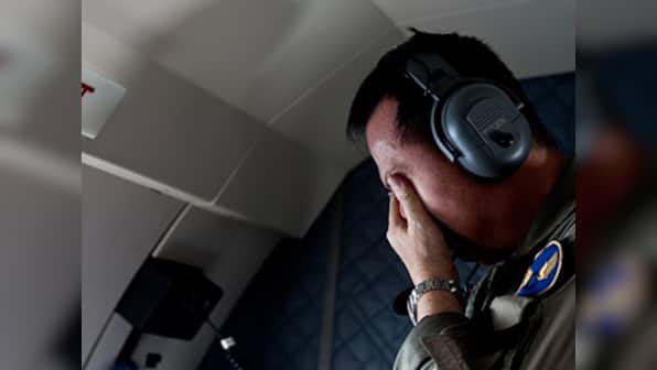 Sonar images find AirAsia's QZ8501 wreckage: Victim wearing life jacket raises questions about crash