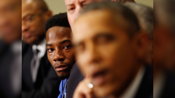President Obama shuns 'militarized' police culture but stays away from riot-hit Ferguson