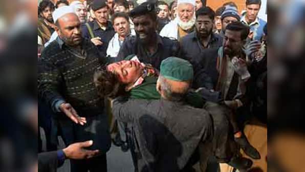 Pakistan in mourning for 141 killed by Taliban in Peshawar school massacre