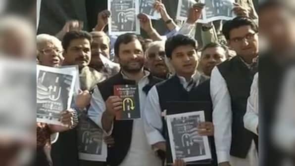 Rahul Gandhi leads protest against Modi govt, poses with 'U-turn Sarkar' book