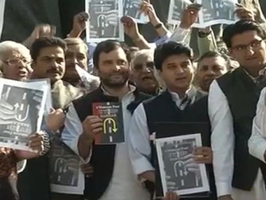 Rahul Gandhi leads protest against Modi govt, poses with 'U-turn Sarkar' book Rahul Gandhi leads protest against Modi govt, poses with 'U-turn Sarkar' book
