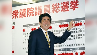 Japan approves cut in corporate taxes to boost economic growth