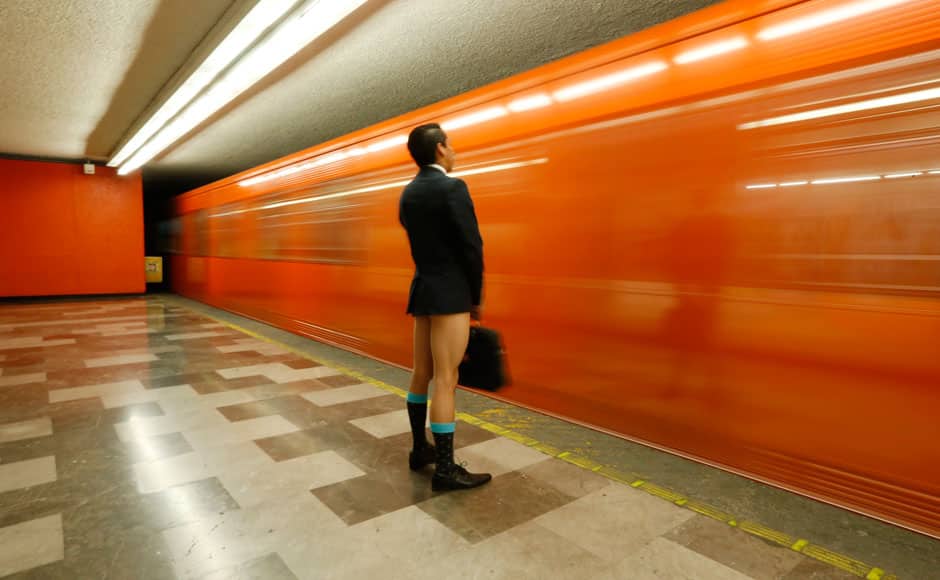 A passenger without pants waits for the subway train during 