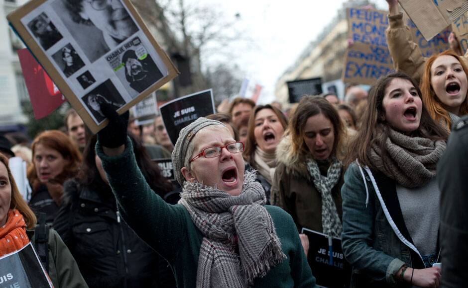 People shout slogans during a rally in Paris, France, Sunday, Jan. 11, 2015. Hundreds of thousands gathered Sunday throughout Paris and cities around the world, to show unity and defiance in the face of terrorism that killed 17 people in France’s bleakest moment in half a century. AP