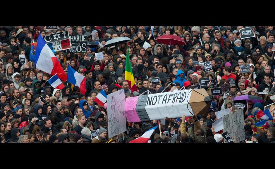 Holding up signs reading 