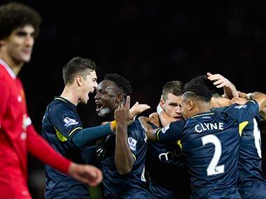Southampton's Victor Wanyama, centre left, celebrates with teammates after their 1-0 win at Manchester United. AP