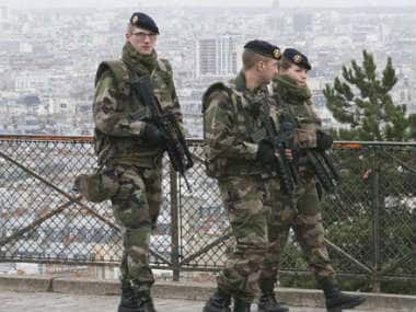 French soldiers patrol around the Sacre Coeur basilica at Montmartre district, in Paris. AP 