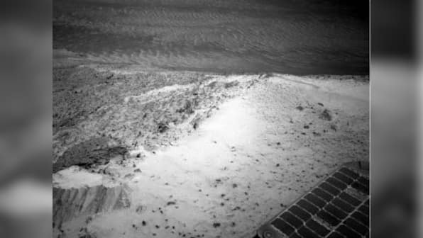 NASA's Opportunity rover takes in view from top of Martian hill as engineers try to fix it 