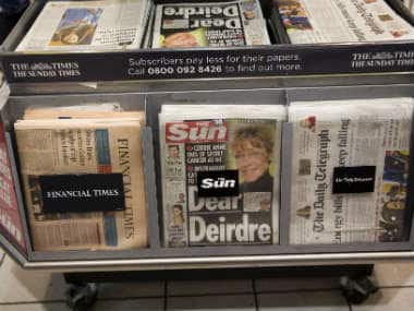 Copies of The Sun tabloid are displayed alongside other newspapers for sale in a shop in London. AP 