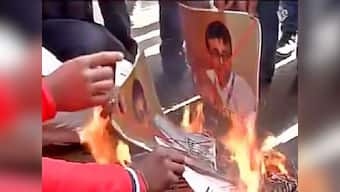 Pakistan terror boat: Protesters burn photos of journalist Praveen Swami in Delhi