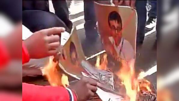 Pakistan terror boat: Protesters burn photos of journalist Praveen Swami in Delhi