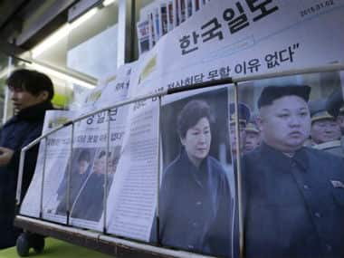 Newspapers reporting North Korean leader Kim Jong Un, right, proposed a summit with South Korean President Park Geun-hye, are sold at a store in Seoul, South Korea. AP