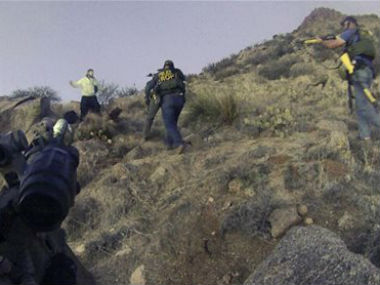 Two US police officers, who shot homeless camper charged with murder Two US police officers, who shot homeless camper charged with murder