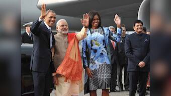 Orange pashmina shawl, pinstriped suit: Modi nearly steals Michelle's fashion thunder