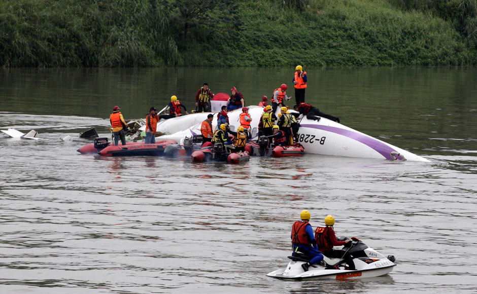 Photos: TransAsia plane crash lands in Taiwan river, 11 feared dead  Photos: TransAsia plane crash lands in Taiwan river, 11 feared dead