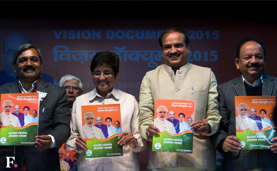Photos: BJP leaders all smiles as Kiran Bedi unveils 'Vision 2015' for Delhi Photos: BJP leaders all smiles as Kiran Bedi unveils 'Vision 2015' for Delhi