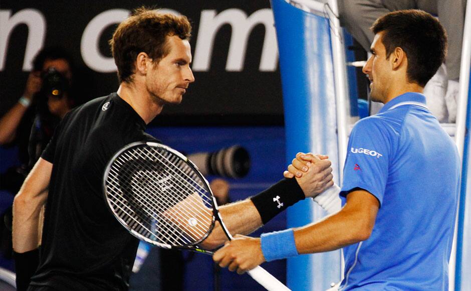 Novak Djokovic (R) of Serbia shakes hands Andy Murray of Britain after winning their men's singles final match at the Australian Open 2015 tennis tournament in Melbourne February 1, 2015. REUTERS