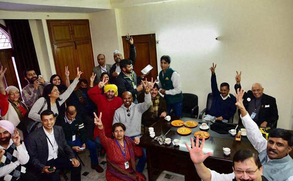 New Delhi : AAP convener Arvind Kejriwal and other party leaders celebrate their win in the Assembly polls, at party office in New Delhi on Tuesday. PTI