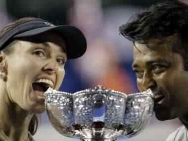 Hingis and Paes pose with the Australian Open Mixed Doubles trophy. AP 