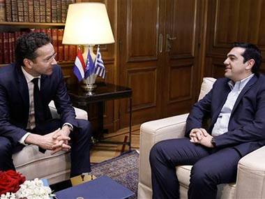 Eurogroup chairman Jeroen Dijsselbloem, left, speaks with Greek Prime Minister Alexis Tsipras. AP