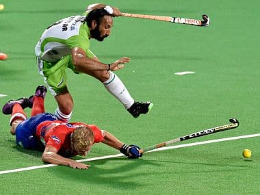 Dabang Mumbai (red) and Delhi Waveriders (green) players in action during their match of the Hockey India League. PTI