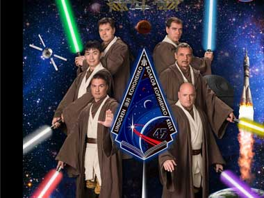 Nasa channels the Force: ISS astronauts pose for portrait with Jedi robes, lightsabers Nasa channels the Force: ISS astronauts pose for portrait with Jedi robes, lightsabers