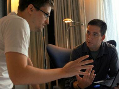 Edward Snowden, left, appears with Glenn Greenwald in a scene from