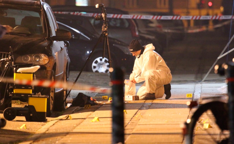 Forensic investigators are seen at the site of the shooting in Copenhagen. A civilian was killed and three police were wounded on Saturday in a shooting at a meeting in Copenhagen attended by Lars Vilks, an artist who has received death threats since publishing images of the Prophet Mohammad. Danish police confirmed one civilian had been killed in the shooting and said the two suspects had fled in a car after the attack on the gathering, which had been billed as a debate on art and blasphemy. Reuters Forensic investigators are seen at the site of the shooting in Copenhagen. A civilian was killed and three police were wounded on Saturday in a shooting at a meeting in Copenhagen attended by Lars Vilks, an artist who has received death threats since publishing images of the Prophet Mohammad. Danish police confirmed one civilian had been killed in the shooting and said the two suspects had fled in a car after the attack on the gathering, which had been billed as a debate on art and blasphemy. Reuters