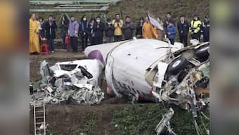 Taiwan's TransAsia plane crash: 'Hero' pilot's body found still clutching joystick