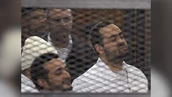 Egyptian activist laughs and claps as court sentences him to life in jail