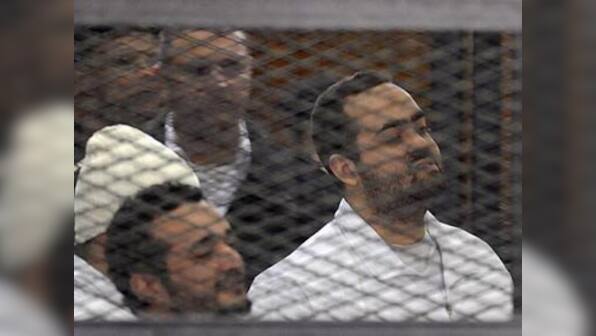 Egyptian activist laughs and claps as court sentences him to life in jail