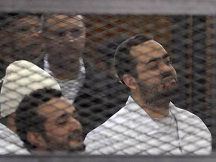 Egyptian activist laughs and claps as court sentences him to life in jail Egyptian activist laughs and claps as court sentences him to life in jail