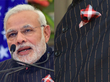 PM Modi's pinstriped suit sold to diamond company for Rs 4.31 cr PM Modi's pinstriped suit sold to diamond company for Rs 4.31 cr