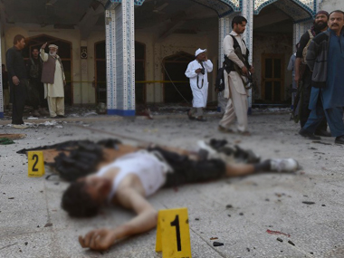 Pakistan: Taliban suicide bombers storm Shia mosque in Peshawar, kill 20 Pakistan: Taliban suicide bombers storm Shia mosque in Peshawar, kill 20