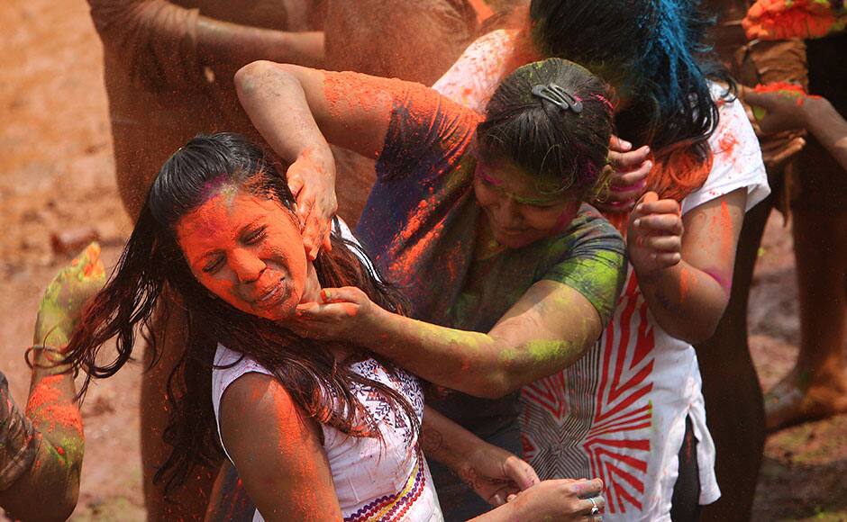 Indian girls throw colored powder on each other during Holi celebrations in Hyderabad, India, Thursday, March 5, 2015. Holi, the Hindu festival of colors, will be marked across the country on March 6. AP