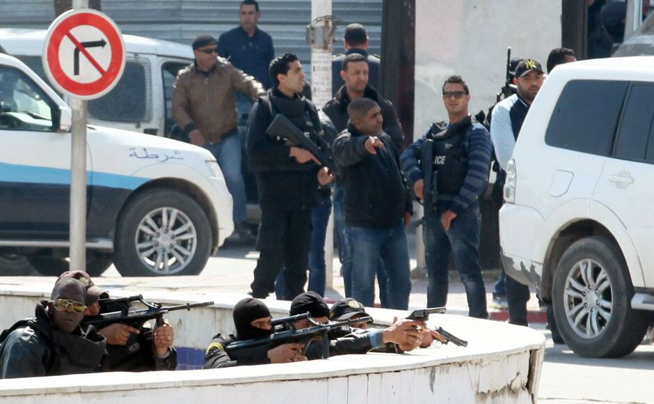 Police officers are seen outside parliament in Tunis March 18, 2015. Gunmen attacked Tunisia's national museum near its parliament on Wednesday, killing at least seven tourists and taking others hostage inside the building, the government said. REUTERS