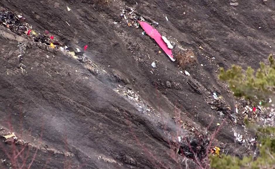 A screen grab taken from an AFP TV video on March 24, 2015 shows debris of the Germanwings Airbus A320 at the crash site in the French Alps above the southeastern town of Seyne. The plane, which had taken off from Barcelona in Spain and was headed for Dusseldorf in Germany, crashed earlier in the day with 150 people onboard. AFP