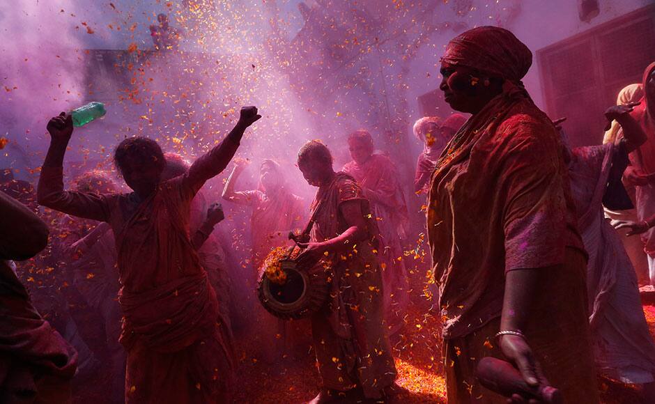 Widows daubed in colours dance as they take part in the Holi celebrations organised by non-governmental organisation Sulabh International at a widows' ashram at Vrindavan organised by non-governmental organisation Sulabh International at a widows' ashram at Vrindavan in the northern Indian state of Uttar Pradesh March 5, 2015. Traditionally in Hindu culture, widows are expected to renounce earthly pleasure so they do not celebrate Holi. But women at the shelter for widows, who have been abandoned by their families, celebrated the festival by throwing flowers and coloured powder. Holi, also known as the Festival of Colours, heralds the beginning of spring and is celebrated all over India. REUTERS