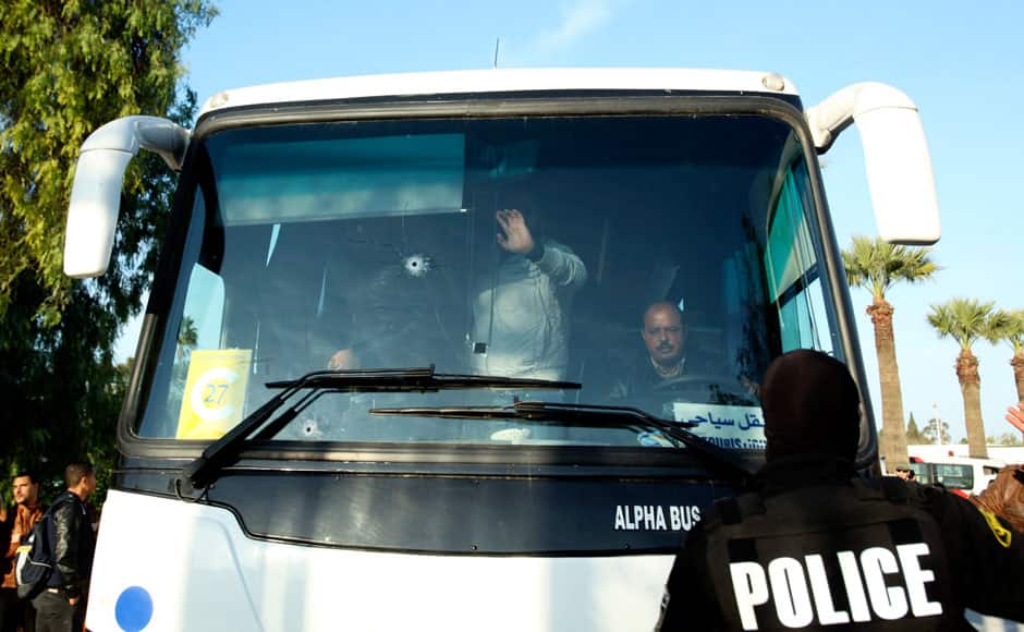 A bus damaged by an attack by gunmen on Tunisia's national museum is seen in Tunis March 18, 2015. Gunmen in military uniforms stormed Tunisia's national museum, killing 17 foreign tourists and two Tunisians on Wednesday in one of the worst militant attacks in a country that has largely escaped the region's 