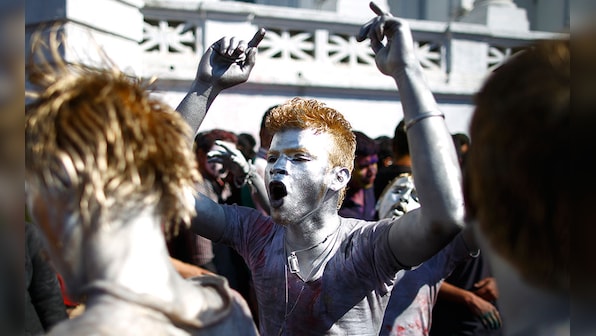 India, Pakistan and Nepal plunge into colours and glee on Holi