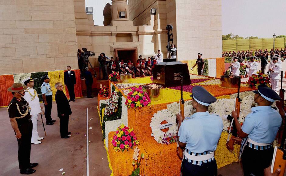 New Delhi: President Pranab Mukherjee on the wreath laying ceremony at India Gate War Memorial on Centenary Commemoration of World War I in New Delhi on Monday. All three Chiefs of defence forces are also seen behind him. PTI 
