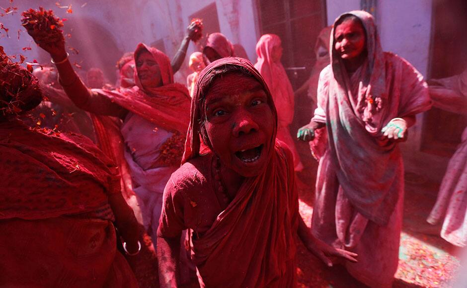 Widows daubed in colours dance as they take part in the Holi celebrations organised by non-governmental organisation Sulabh International at a widows' ashram at Vrindavan organised by non-governmental organisation Sulabh International at a widows' ashram at Vrindavan in the northern Indian state of Uttar Pradesh March 5, 2015. Traditionally in Hindu culture, widows are expected to renounce earthly pleasure so they do not celebrate Holi. But women at the shelter for widows, who have been abandoned by their families, celebrated the festival by throwing flowers and coloured powder. Holi, also known as the Festival of Colours, heralds the beginning of spring and is celebrated all over India. REUTERS