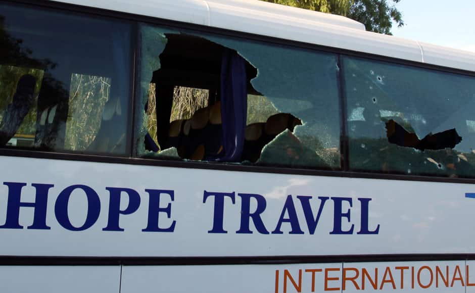 A damaged bus is seen after an attack by gunmen on Tunisia's national museum in Tunis March 18, 2015. Gunmen in military uniforms stormed Tunisia's national museum, killing 17 foreign tourists and two Tunisians on Wednesday in one of the worst militant attacks in a country that has largely escaped the region's 