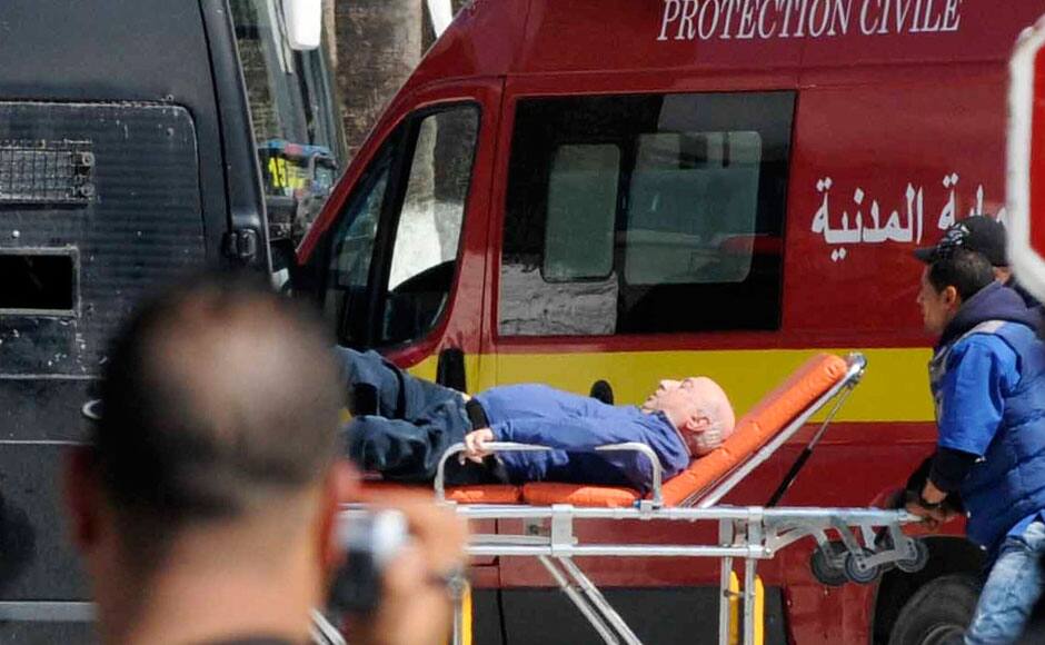 A tourist injured after an attack by gunmen on Tunisia's national museum is wheeled on a stretcher in Tunis March 18, 2015. Gunmen in military uniforms stormed Tunisia's national museum, killing 17 foreign tourists and two Tunisians on Wednesday in one of the worst militant attacks in a country that has largely escaped the region's 