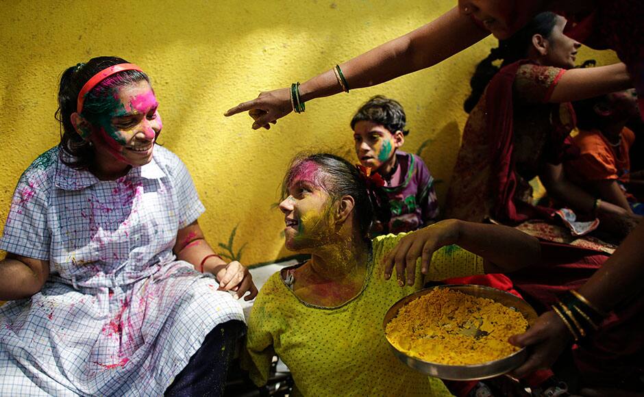 Children covered in coloured powder play during celebrations of Holi, also known as the festival of colours, at the Society for the Education of the Crippled in Mumbai March 4, 2015. The traditional event heralds the beginning of spring and is celebrated all over India. REUTERS