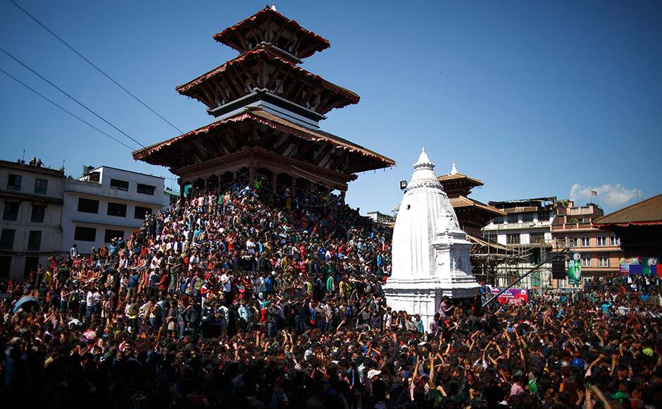 People gather to celebrate Holi, the Festival of Colours, in Kathmandu March 5, 2015. Holi heralds the beginning of spring and is celebrated all over Nepal. REUTERS