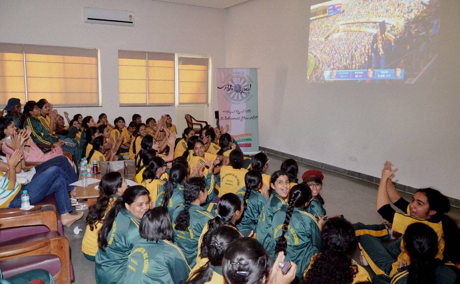 Bhopal: Cricket fans watch live telecast of Cricket World Cup semi final match between India and Australia, in Bhopal on Thursday. PTI