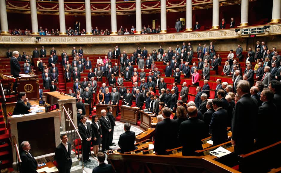 Members of the French government and deputies observe a minute of silence during a session at the National Assembly in Paris March 24, 2015. An Airbus plane operated by Lufthansa's Germanwings budget airline, en route from Barcelona to Duesseldorf, crashed in a remote snowy area of the French Alps on Tuesday killing all 150 on board including 16 schoolchildren. REUTERS