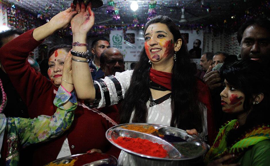 Women from the Pakistani Hindu community celebrate Holi, the spring festival of colors in Lahore, Pakistan, Thursday, March 5, 2015. (AP